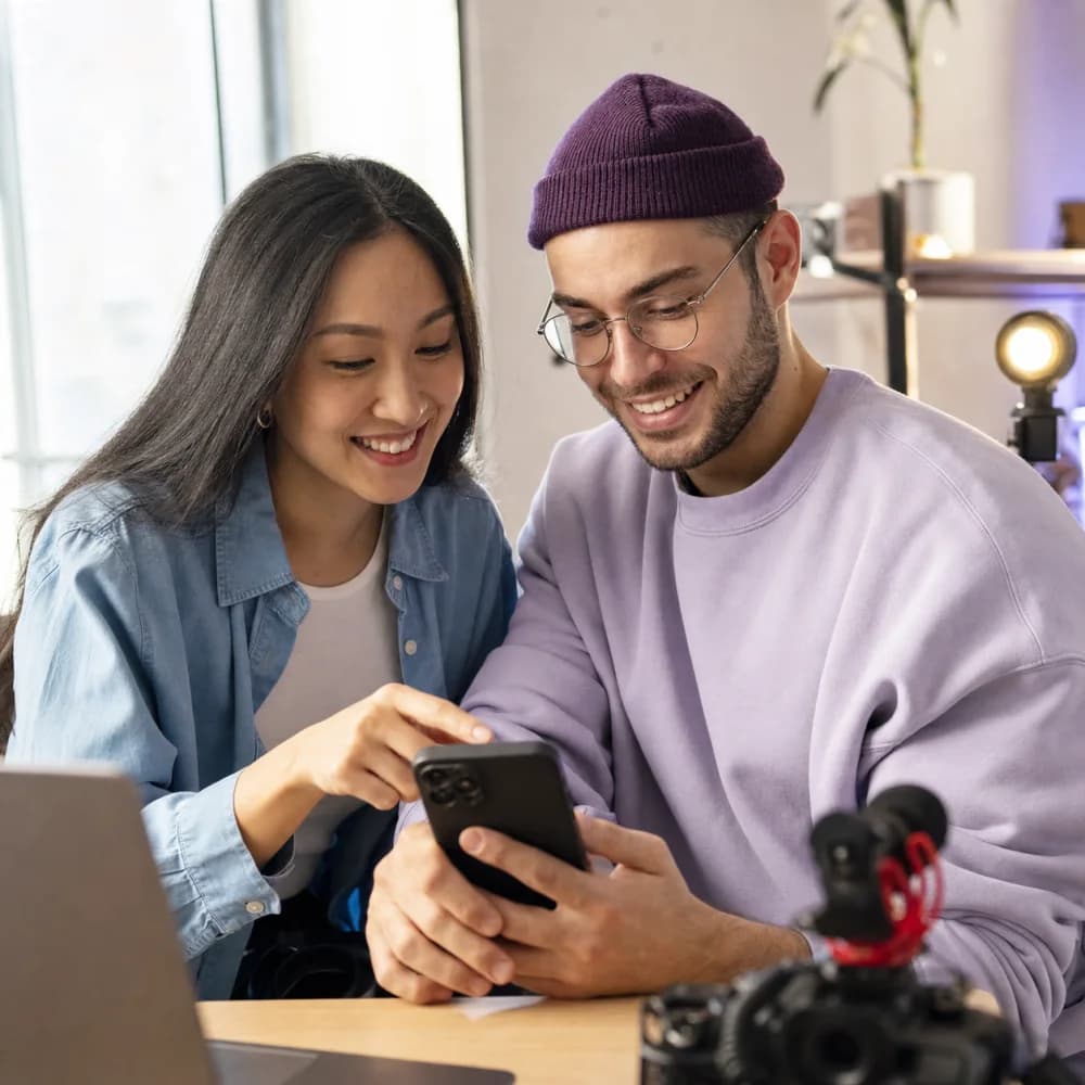 Two creators reviewing a video together